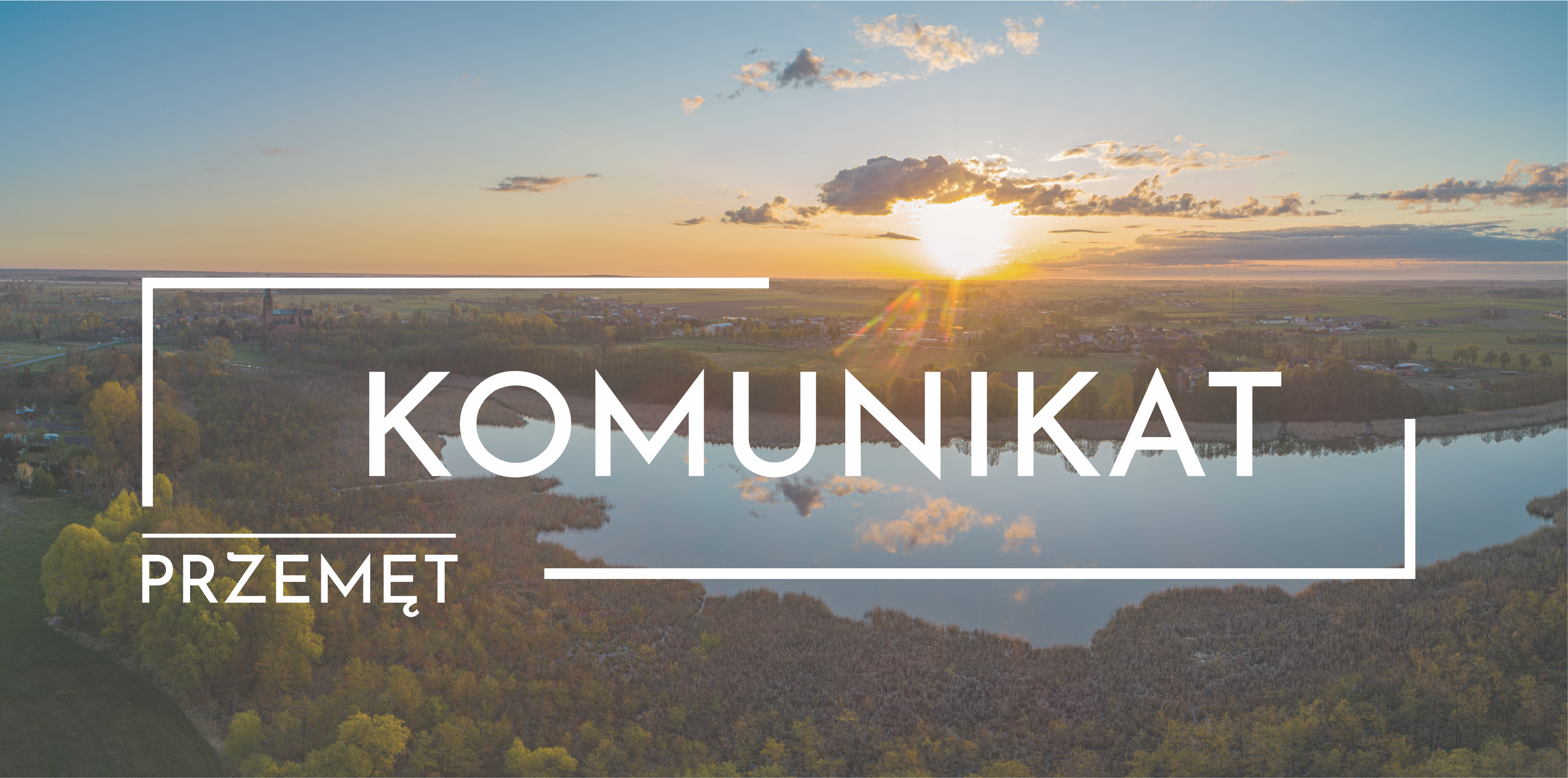 Grafika przedstawia jezioro w Przemęcie o wschodzie słońca. Na środku grafiki znajduje się biały napis: "KOMUNIKAT", pod nim z lewej strony mniejszymi literami napis: "PRZEMĘT".